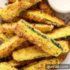 Crispy Air Fryer Zucchini Fries 3 pile of air fryer zucchini fries on white plate