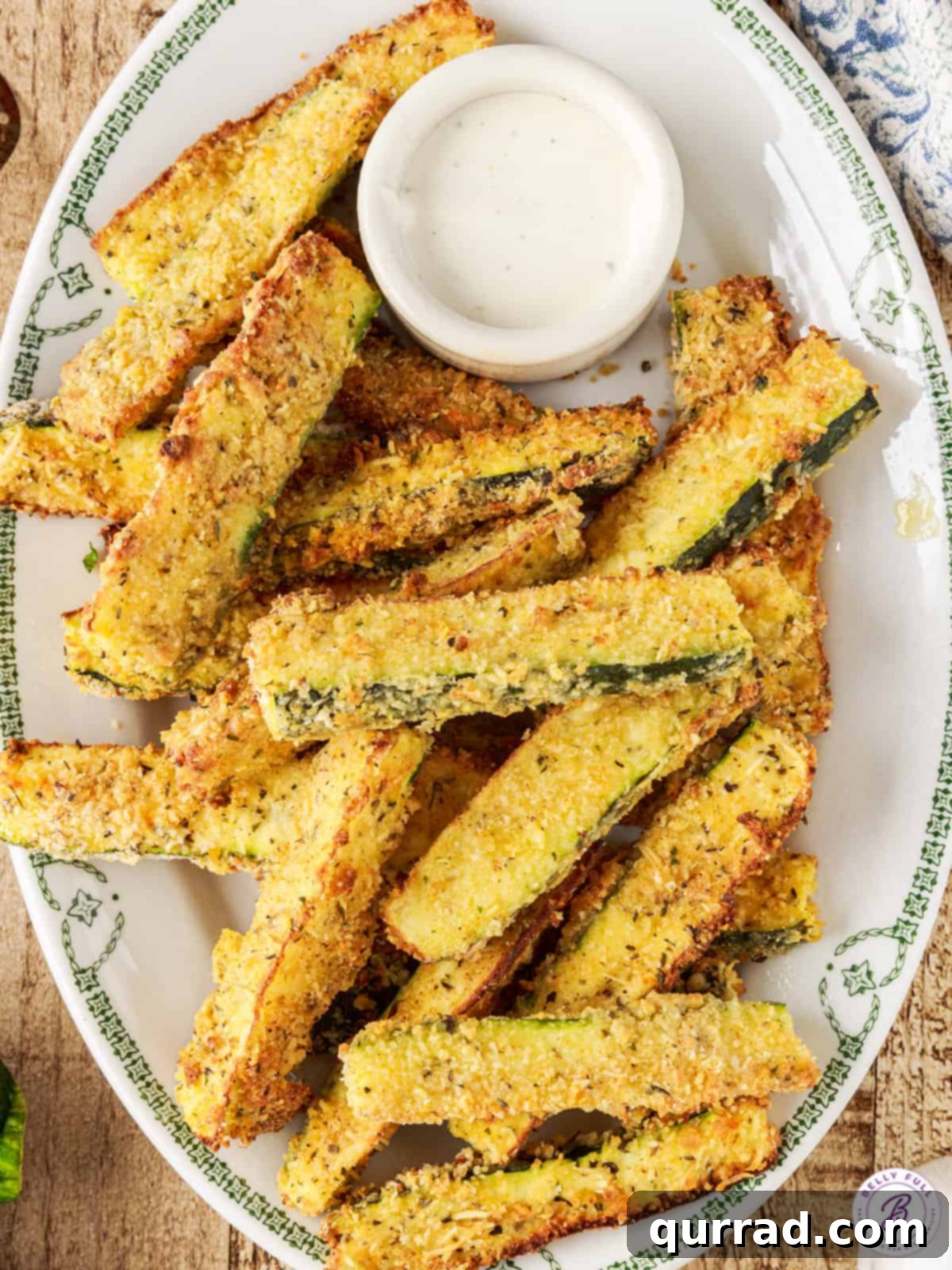 Crispy Air Fryer Zucchini Fries 5 overhead plate of breaded zucchini wedges