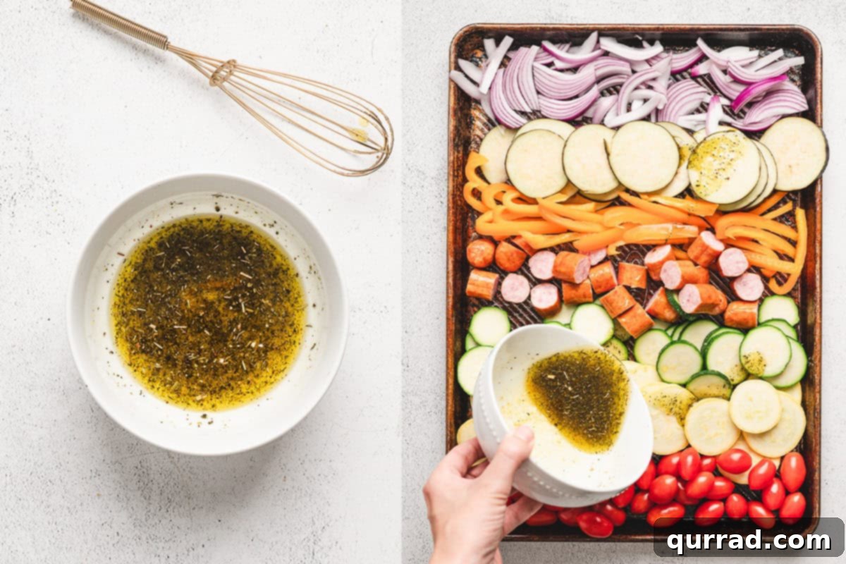Cherry tomatoes and sliced smoked sausage added to the sheet pan with vegetables