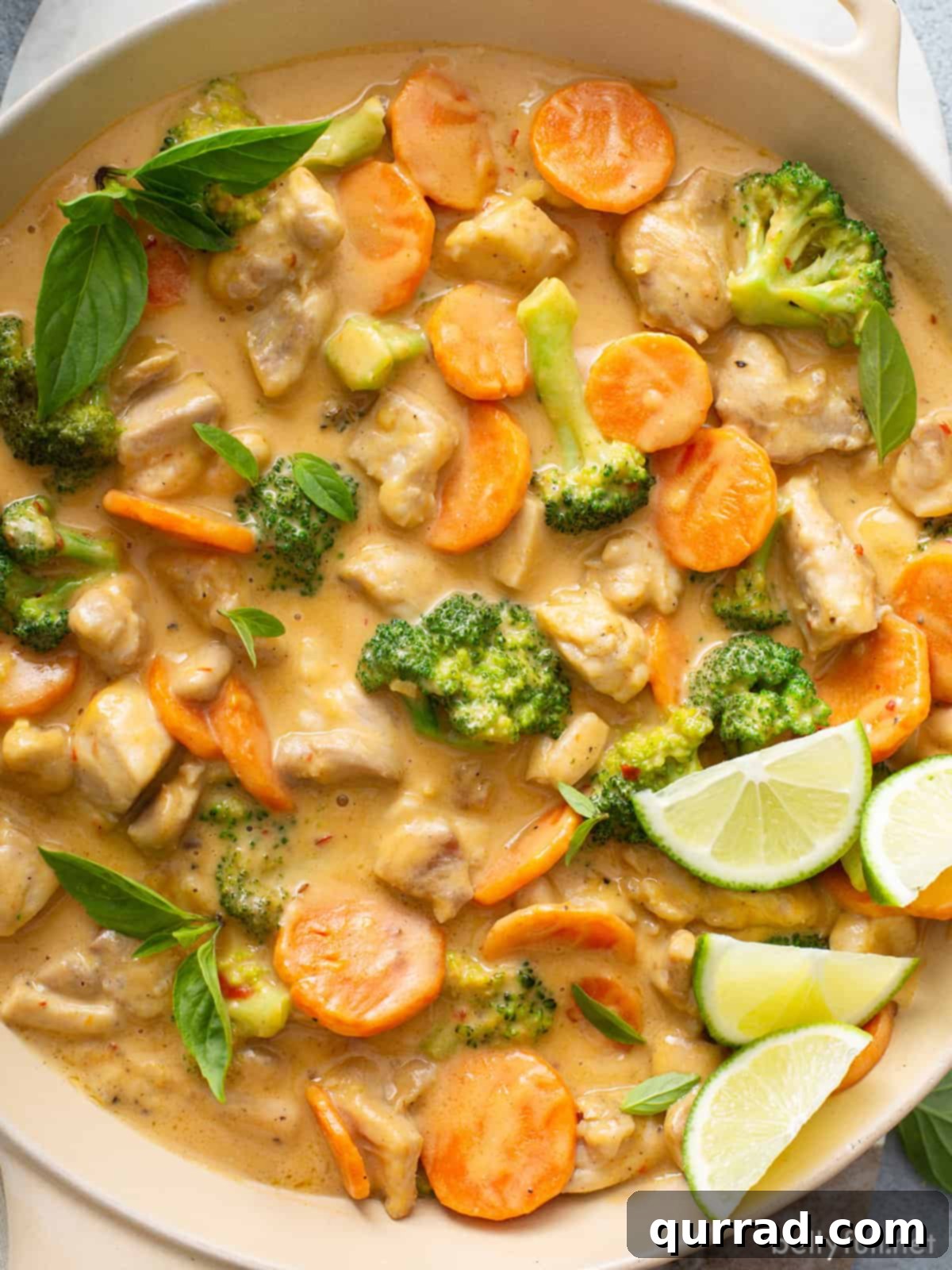 Dreamy Thai Coconut Chicken 2 A skillet of Thai coconut chicken, rich with creamy sauce and vegetables.