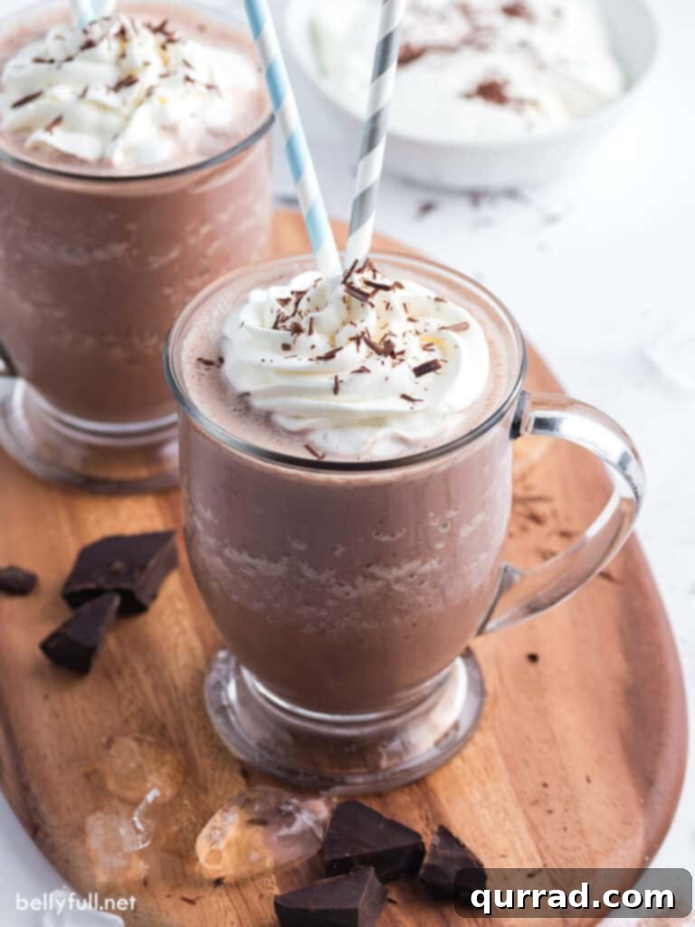 frozen hot chocolate drink in glass with whipped cream