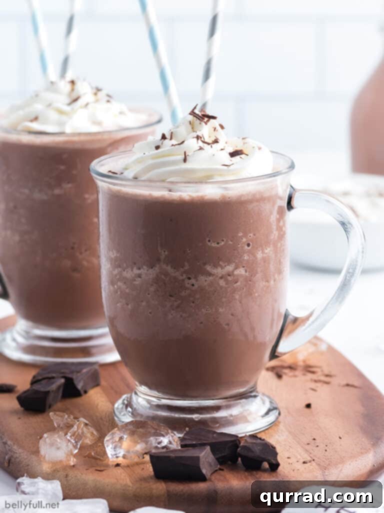chocolate frosty drink in glass with whipped cream