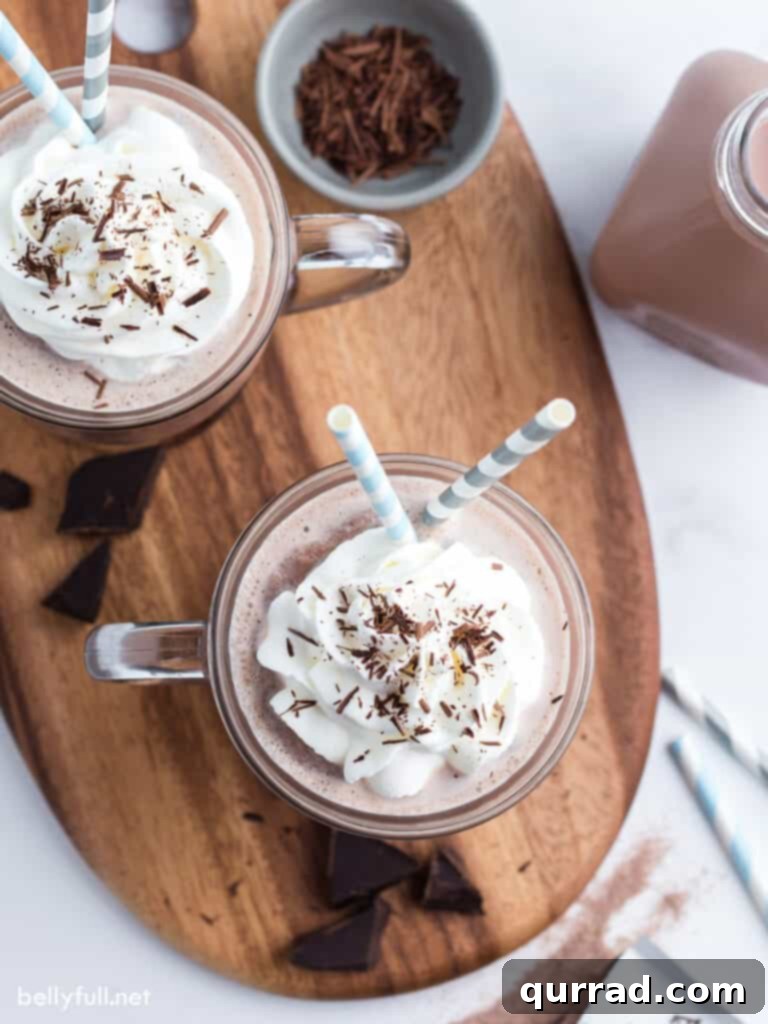 overhead chocolate drink topped with whipped cream and chocolate shavings