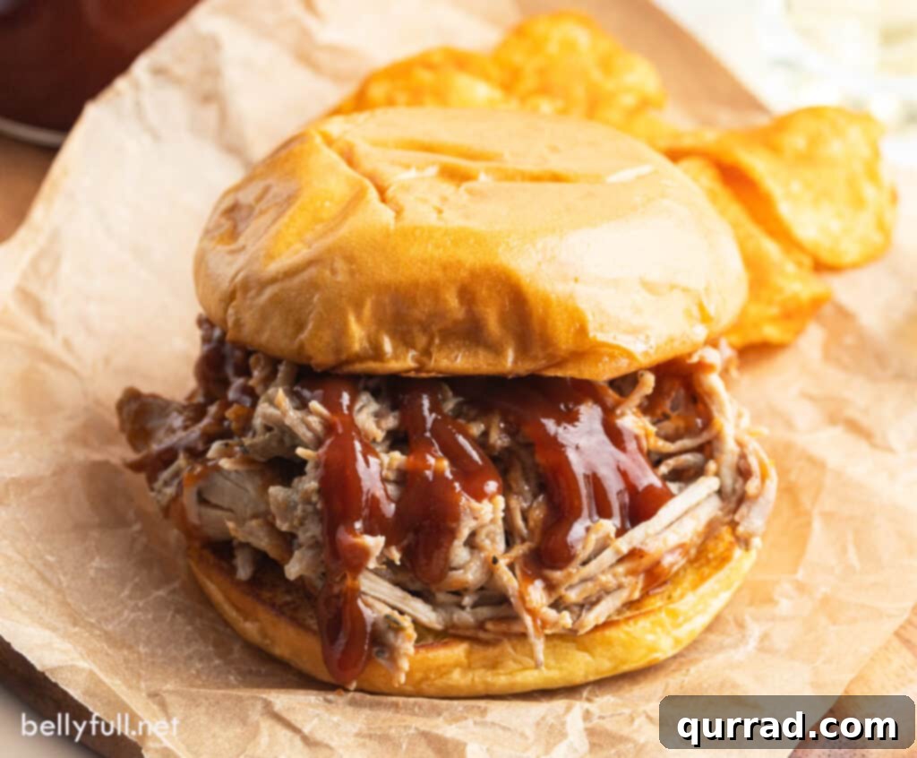Grill Master's Secret BBQ Sauce 4 A mouth-watering pulled pork sandwich generously coated with homemade BBQ sauce, garnished with fresh cilantro.
