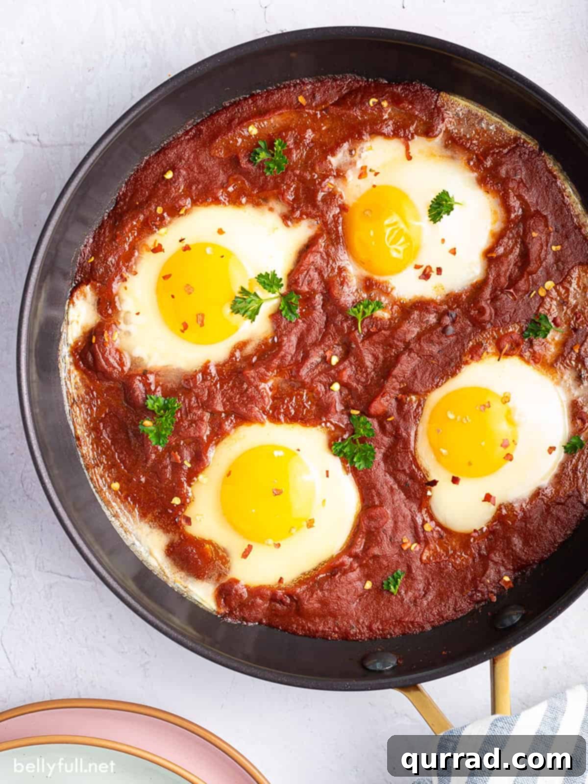 Inferno Baked Eggs 3 Eggs in purgatory cooking in a skillet
