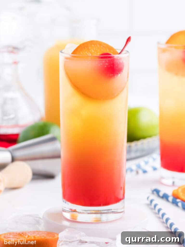 Dawn's Golden Kiss 2 Tequila Sunrise cocktail showcasing its vibrant layered colors