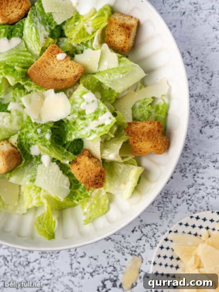 Imperial Romaine Delight 3 overhead close up salad with Romaine lettuce, shaved parmesan, and croutons