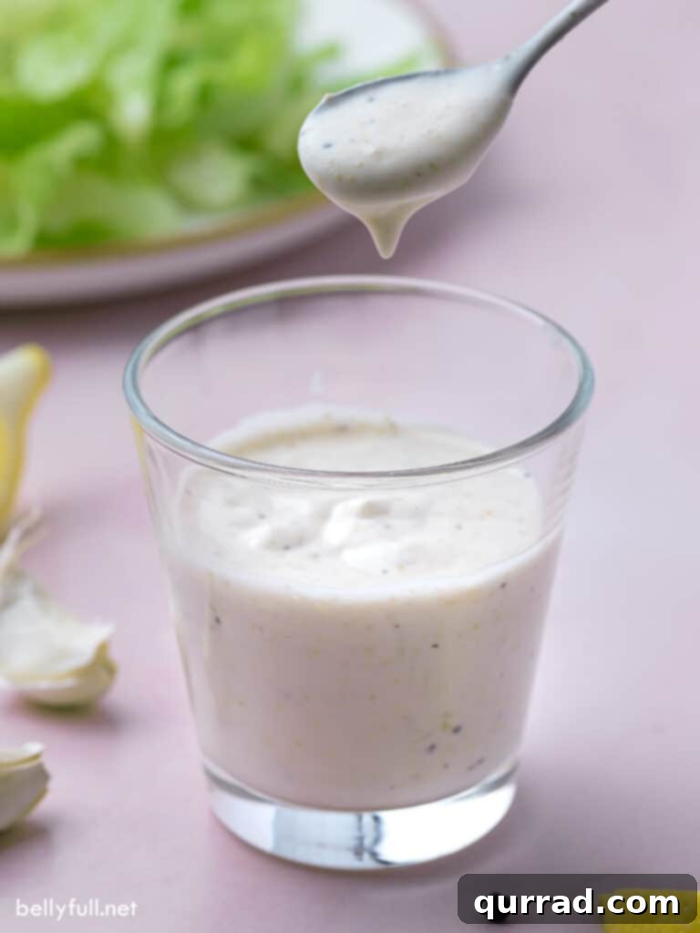 Imperial Romaine Delight 4 creamy dressing dripping from spoon onto glass