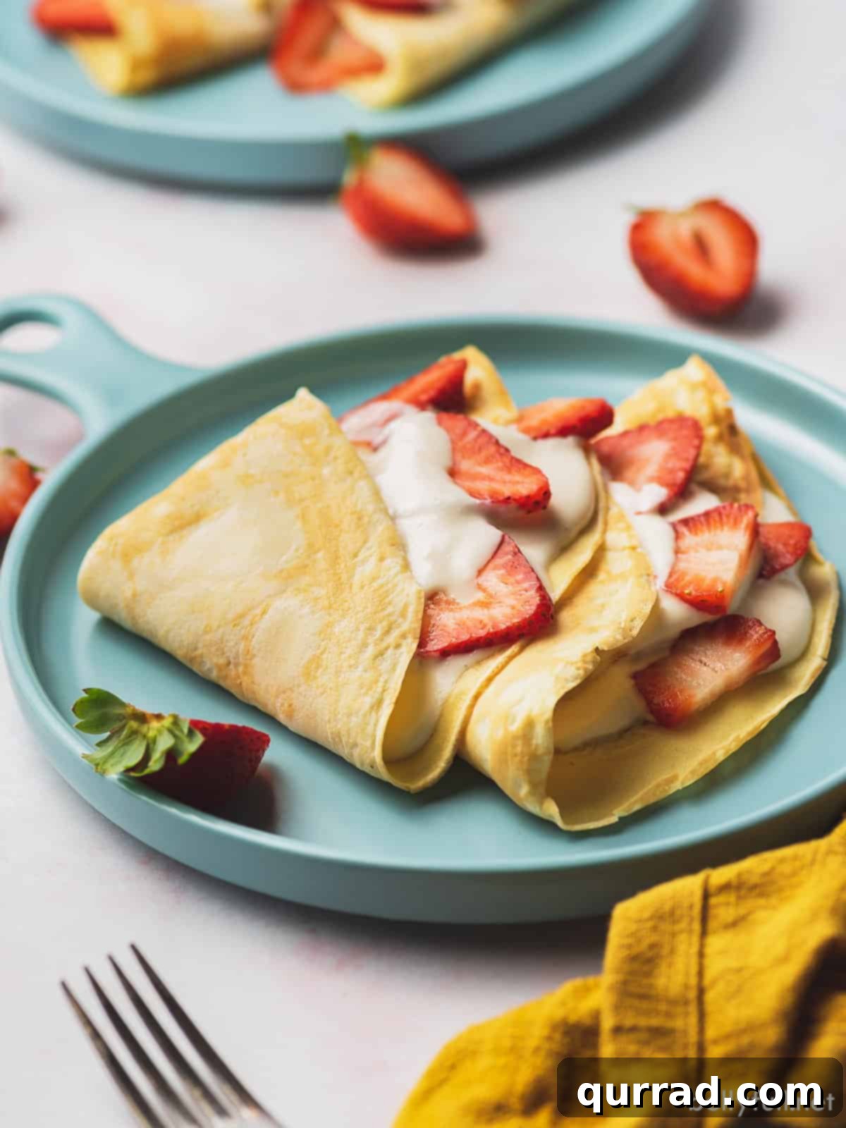 Berry Kissed Crepes 4 strawberry crepes with cream filling and fresh sliced strawberries