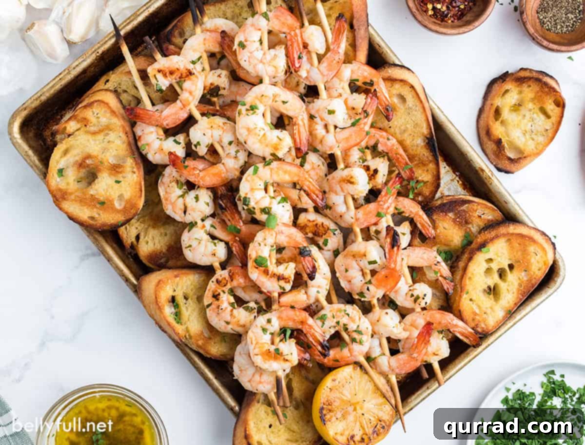 Flame-Kissed Shrimp Scampi 4 A sheet pan of grilled shrimp and baguette slices