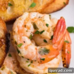 Flame-Kissed Shrimp Scampi 6 close up grilled shrimp with butter and parsley