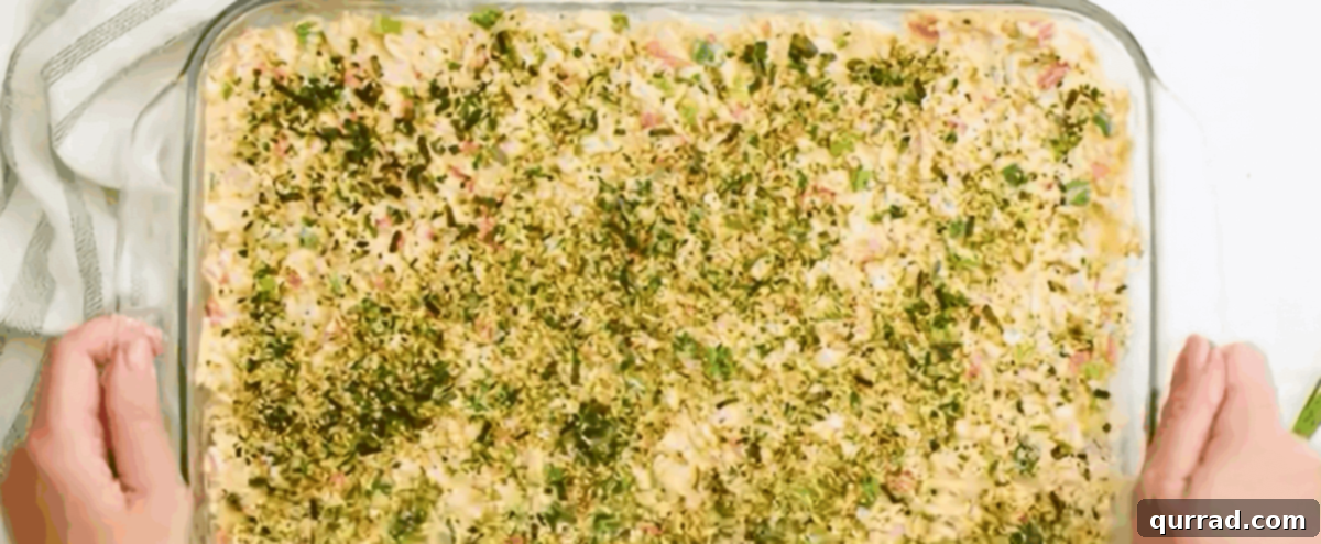 Baked Sushi Bliss 7 Assembled, unbaked sushi bake in a glass casserole dish.