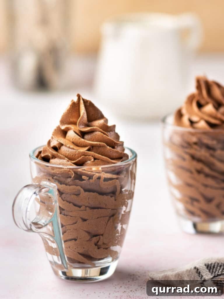 Rich and Creamy Chocolate Frosting 3 frosting piped tall in clear glass