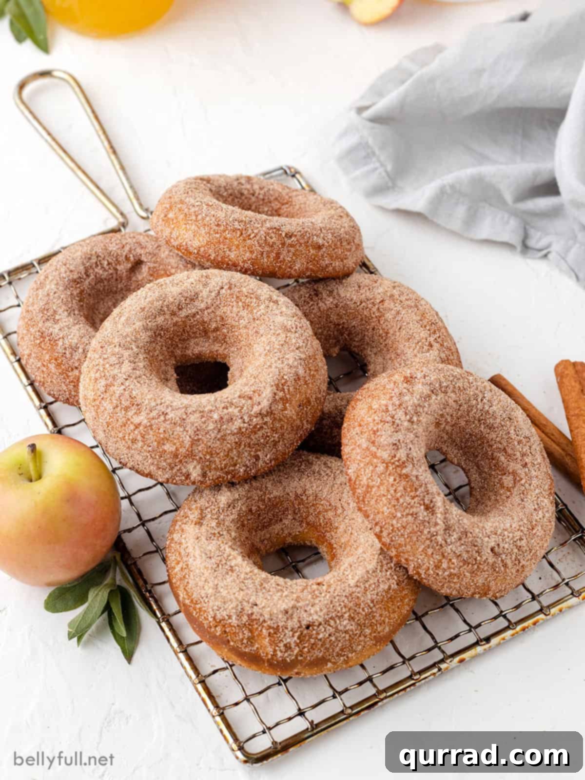 Baked apple cider donuts on a wire rack