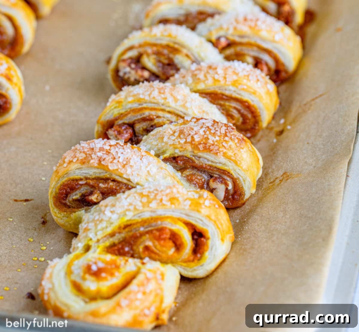 Cozy Pumpkin Pull-Apart Buns 3 Freshly baked pumpkin pull-apart bread, golden brown and glistening with a vanilla glaze, presented beautifully on a rustic wooden board, ready to be served.