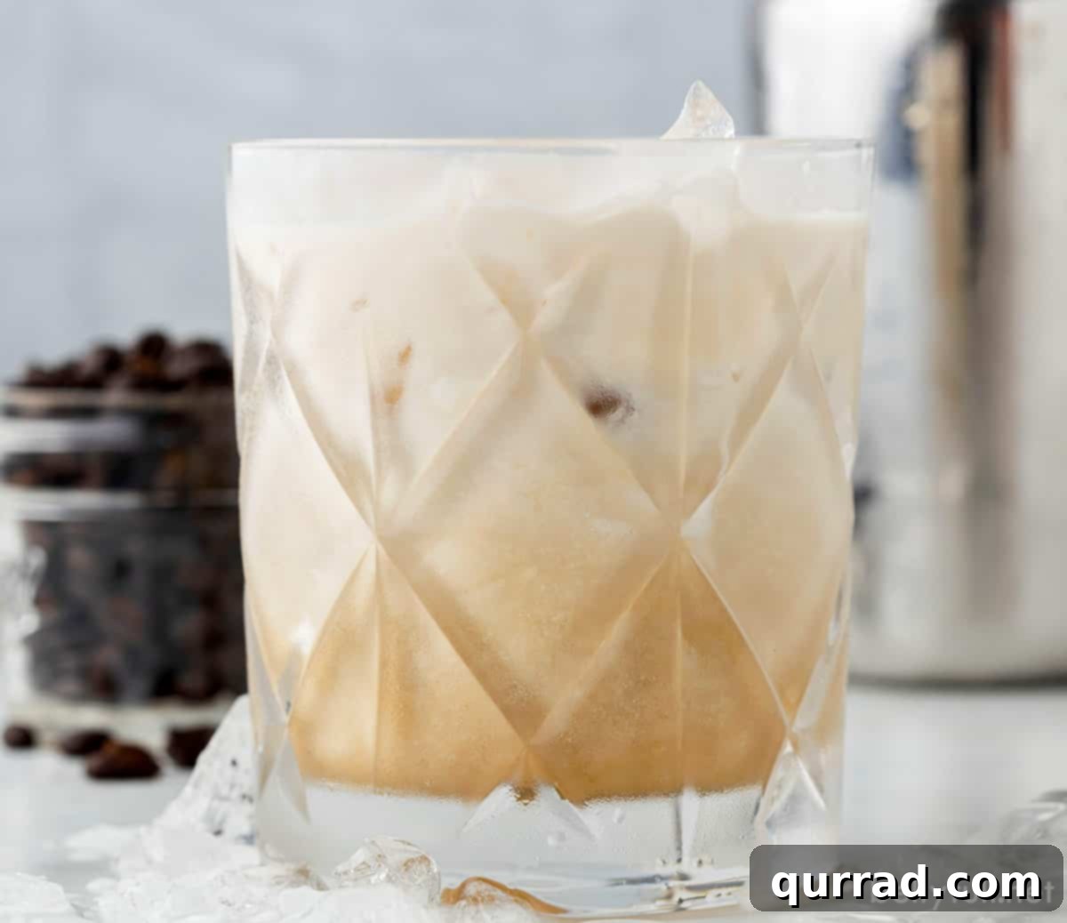 Velvet Nightcap 5 A beautifully creamy White Russian cocktail in a elegant glass, garnished with a coffee bean.