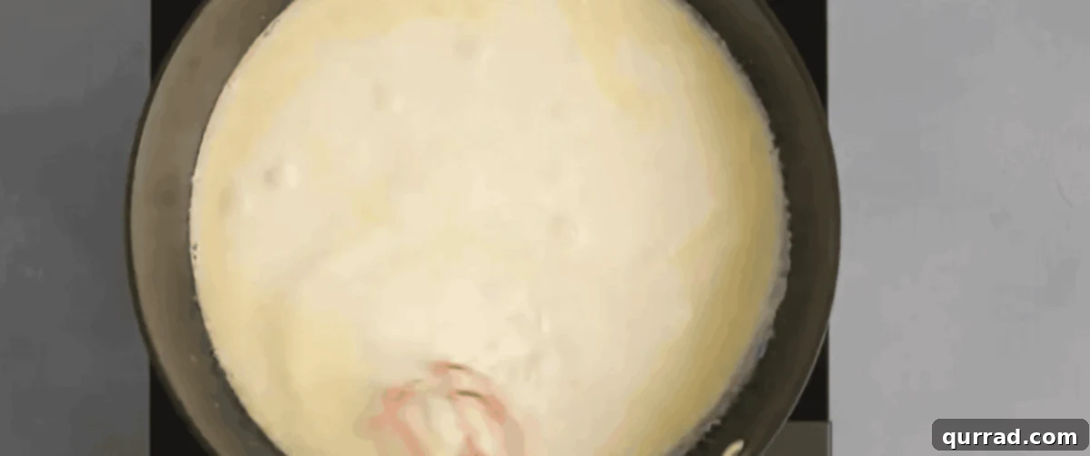 Combining butter and cream in a skillet. 