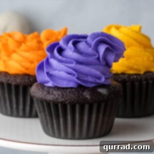 Front view of 3 Hocus Pocus cupcakes