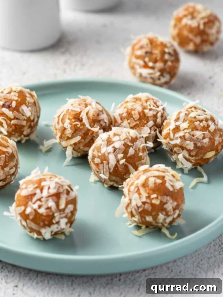 Carrot Cake Bliss Bites 3 Several perfectly formed carrot cake energy bites arranged neatly on a plate, highlighting their appetizing appearance.