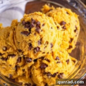 A bowl of scoops of pumpkin edible cookie dough, ready to eat