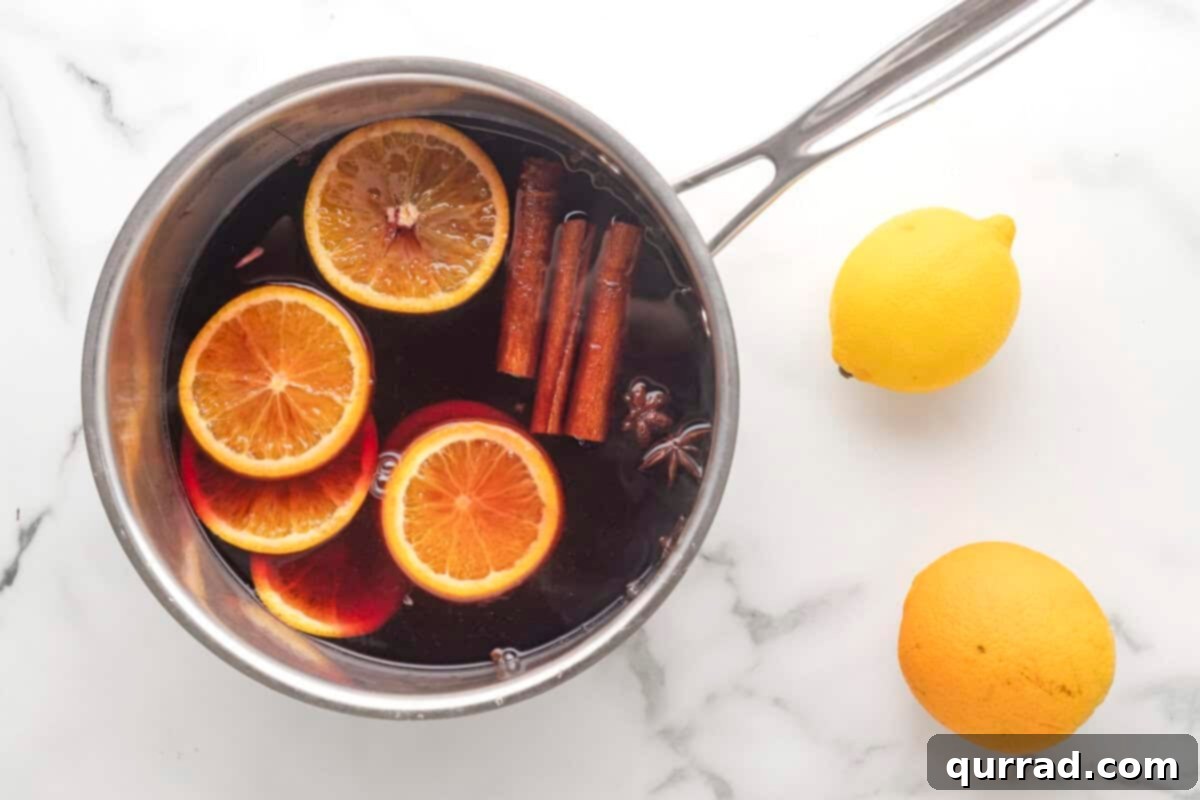 Spiced Winter Warmth 7 The mulled wine mixture gently simmering in a pot, with visible orange slices and whole spices infusing the liquid.