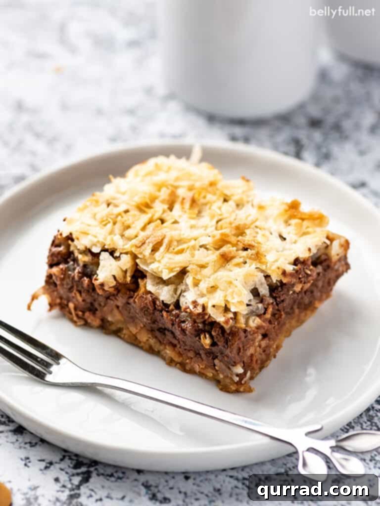 Magic Bars 4 magic bar on white plate with tasting fork