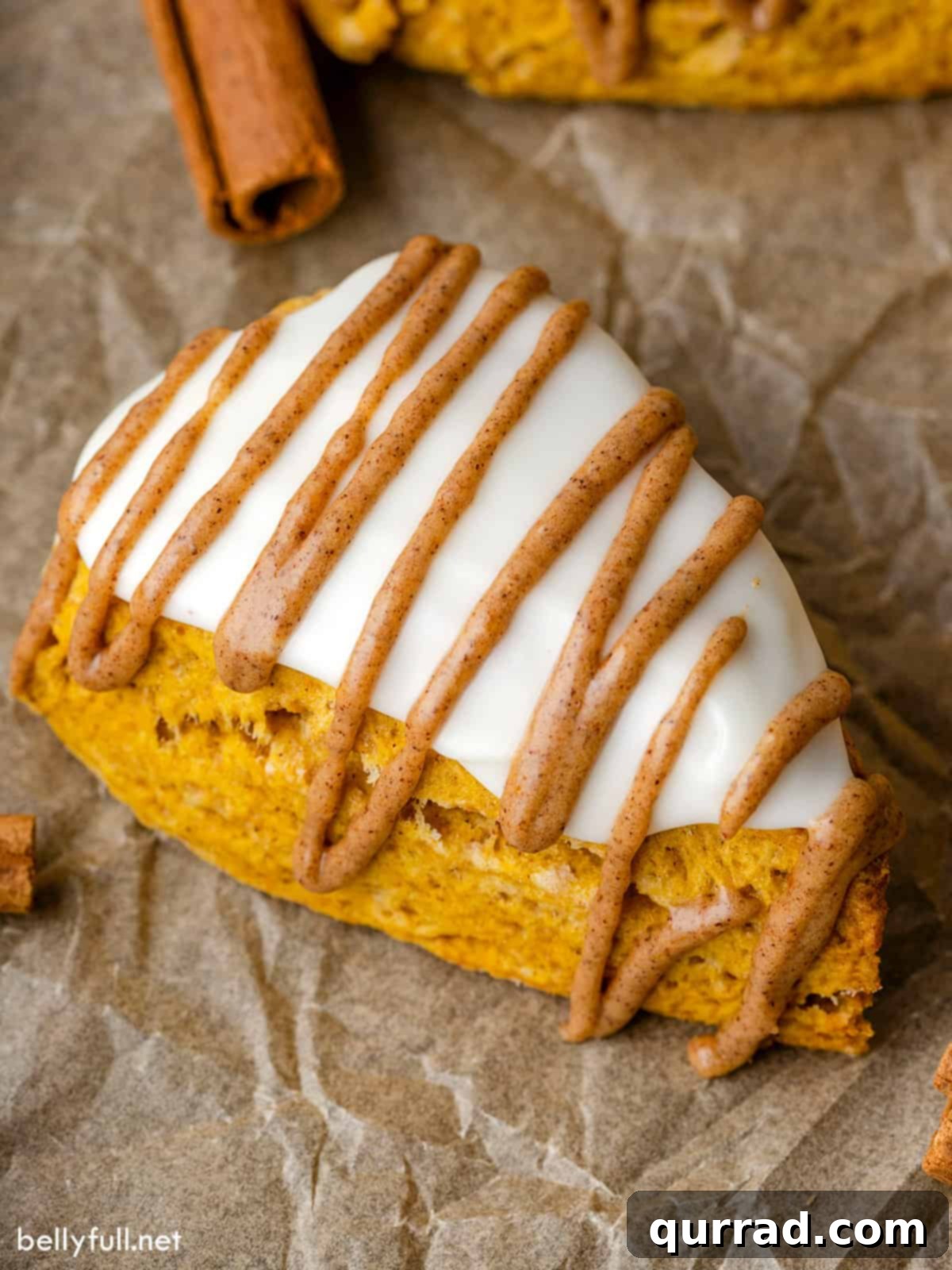 Overhead view of an easy pumpkin scone with dual glazes