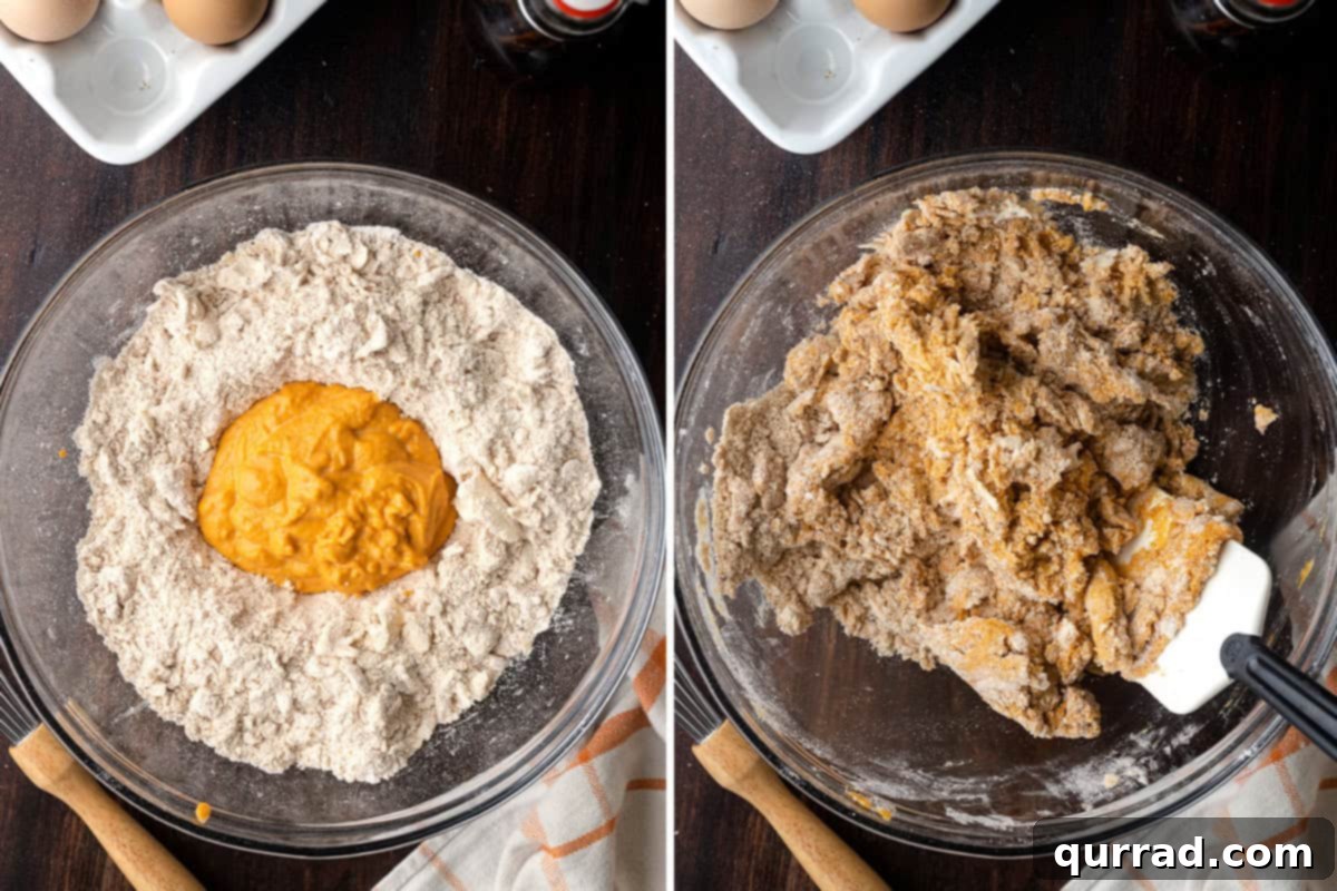 Pumpkin scone dough beginning to form in a mixing bowl