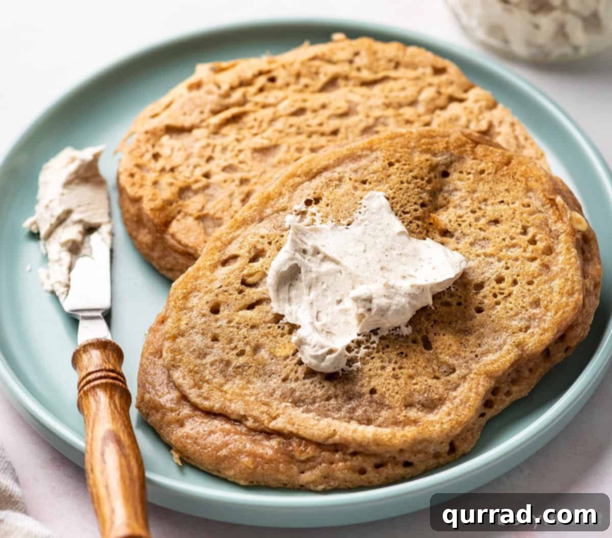 Maple Cloud Butter 5 Whipped maple butter dolloped on a stack of pumpkin pancakes, ready to be enjoyed