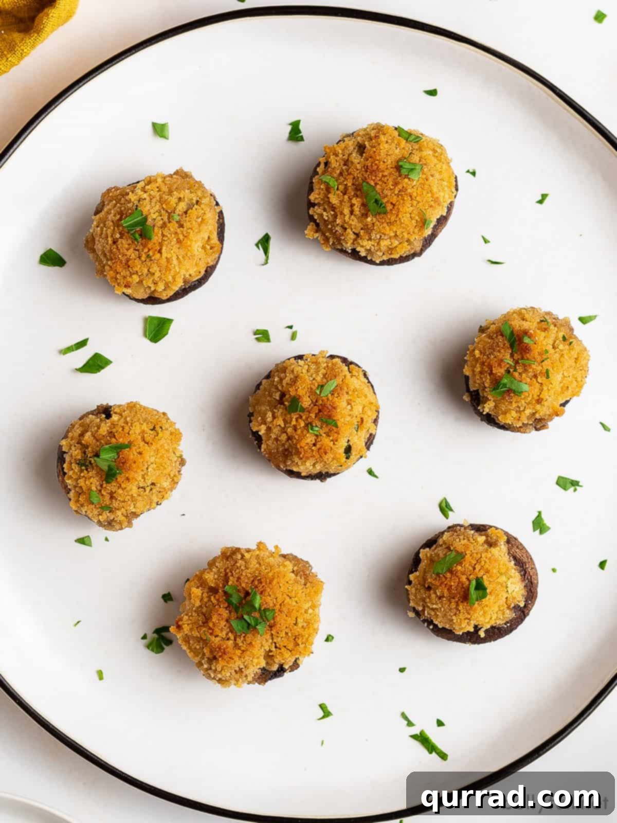 Velvet Crab Stuffed Mushrooms 3 Overhead view of crab stuffed mushrooms with cream cheese, ready to be served