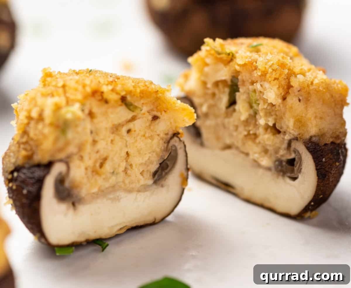 Velvet Crab Stuffed Mushrooms 5 A crab stuffed mushroom cut in half, showing the rich filling