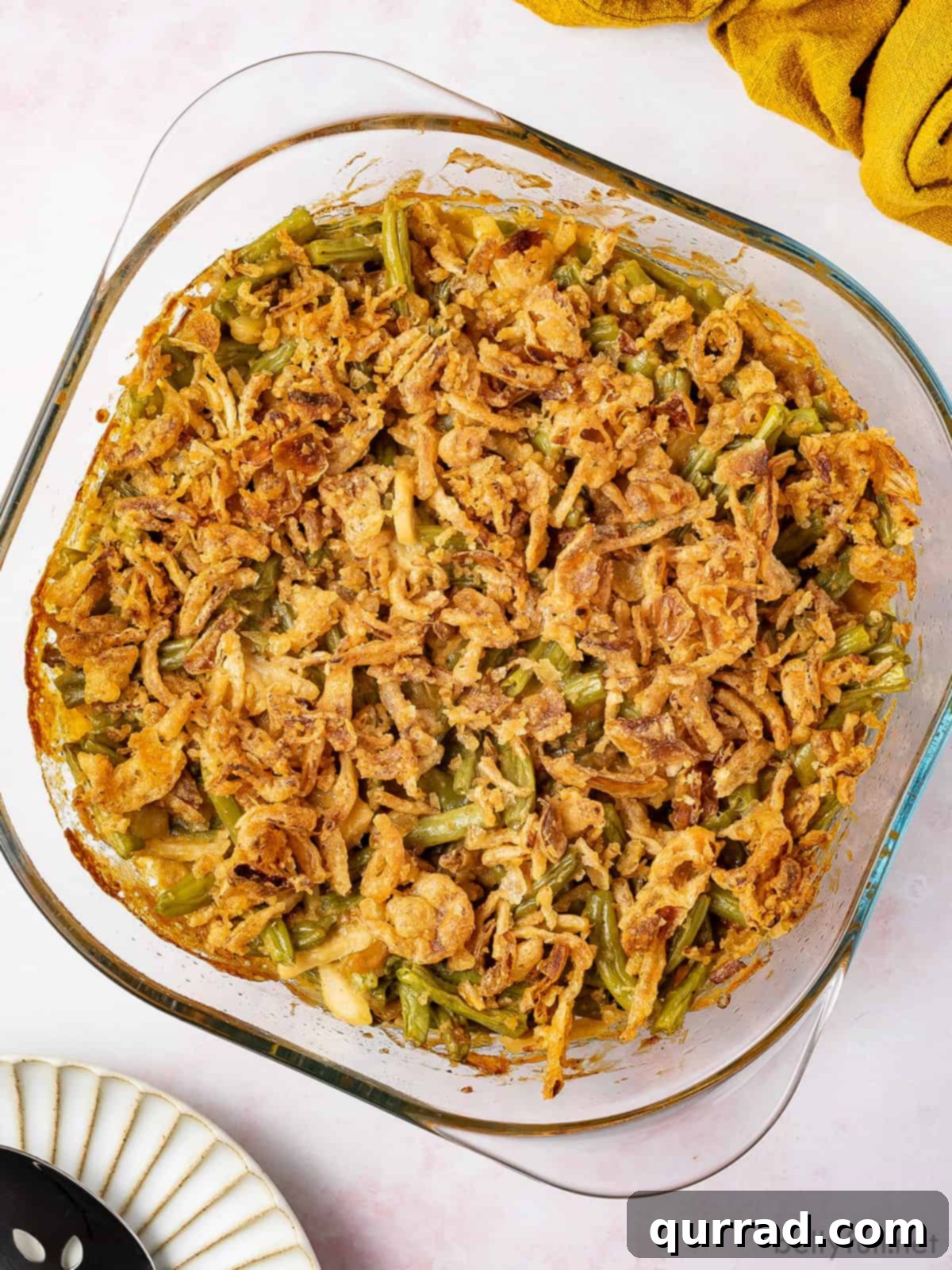 Comforting Green Bean Bake 4 Overhead view of a baking dish of green bean casserole, showing its golden-brown topping.