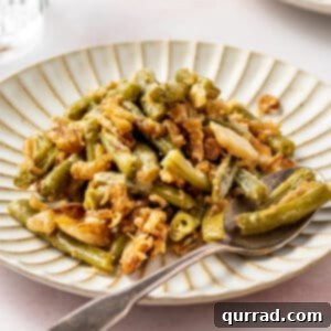 Comforting Green Bean Bake 6 A plate of green bean casserole with a fork