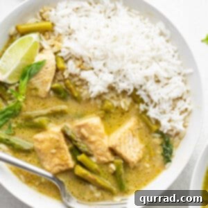 Emerald Green Thai Curry 6 A bowl of Thai green curry with fish and jasmine rice