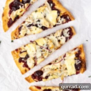 Overhead view of turkey cranberry brie pizza