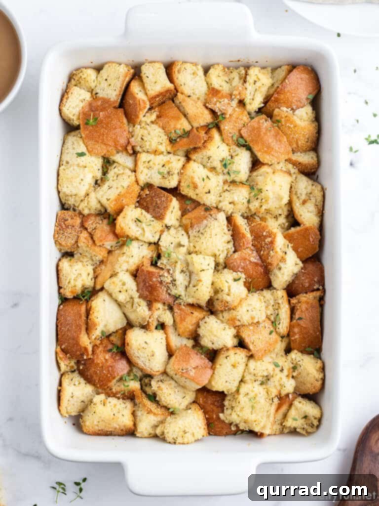 Nana's Simple Stuffing Recipe 2 Classic turkey stuffing in a white casserole dish, ready to be served for Thanksgiving or a holiday meal.