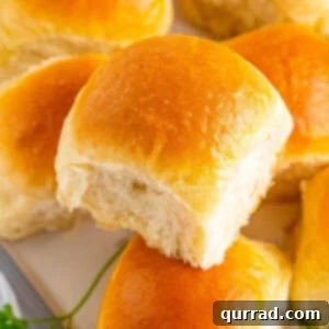 Pillowy Dinner Rolls 6 Overhead view of homemade dinner rolls on a plate