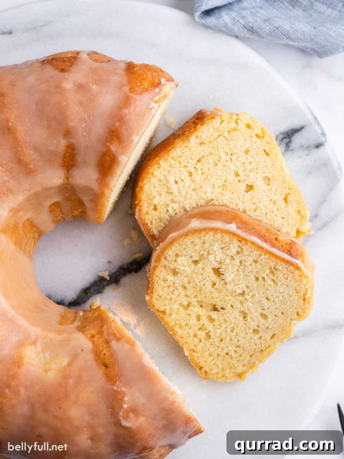 Kentucky butter cake with two slices already removed and placed on their sides, showcasing the golden crust and moist texture