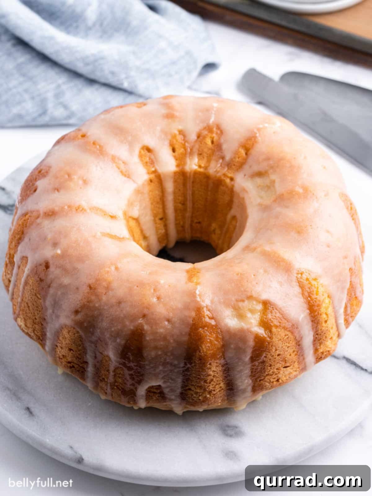Overhead close-up view of a perfectly baked Kentucky butter cake, showing its golden-brown crust and moist texture, ready to be sliced