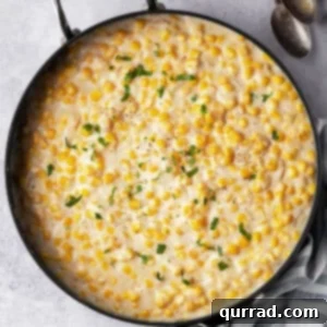 Overhead view of a skillet of creamed corn