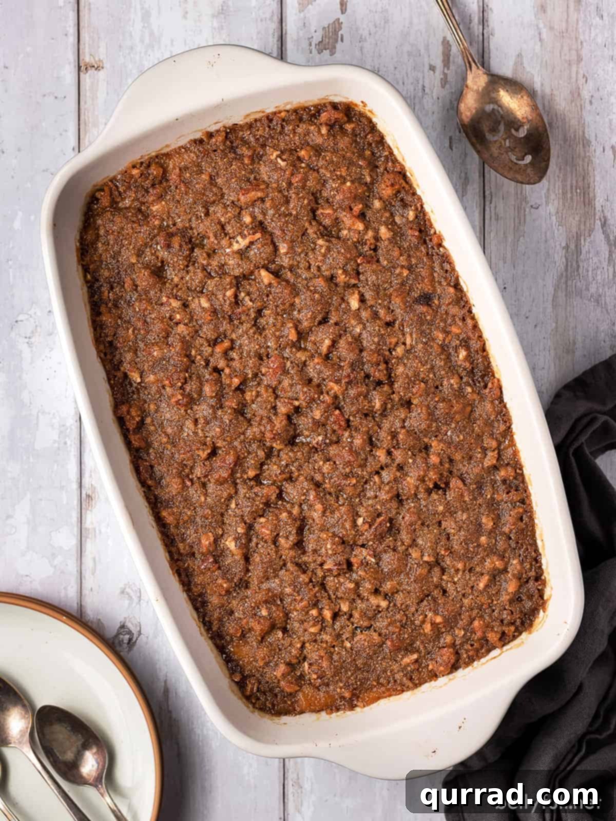 Heavenly Sweet Potato Bake 3 Close-up overhead shot of a sweet potato casserole, showing the smooth filling and rich pecan crumble topping.