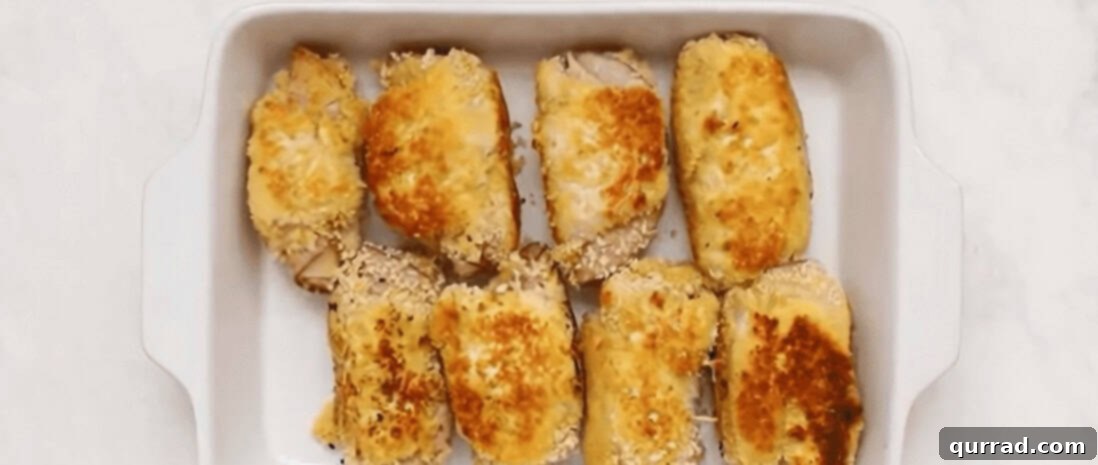 Golden Chicken Ham and Swiss 8 Pan-fried, rolled chicken cordon bleu arranged in a baking dish.