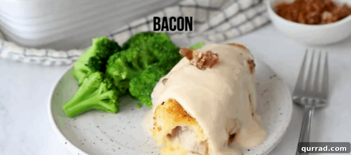 Golden Chicken Ham and Swiss 10 Drizzling Alfredo sauce and sprinkling bacon over chicken cordon bleu on a plate with roasted broccoli.