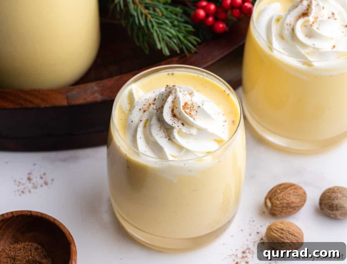 Winter Warmer Eggnog 3 Three beautifully presented glasses of homemade eggnog, invitingly ready for holiday indulgence.