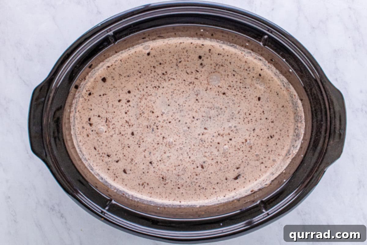 Dreamy Slow Cooker Hot Cocoa 5 heavy cream and cocoa powdered mixed together in crockpot