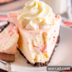 front angle of no bake peppermint cheesecake with bite taken