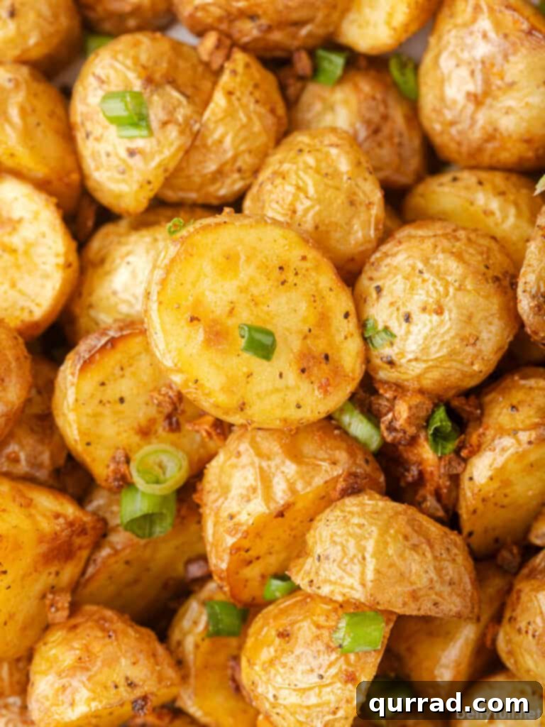 close up crispy roasted potatoes with scallions