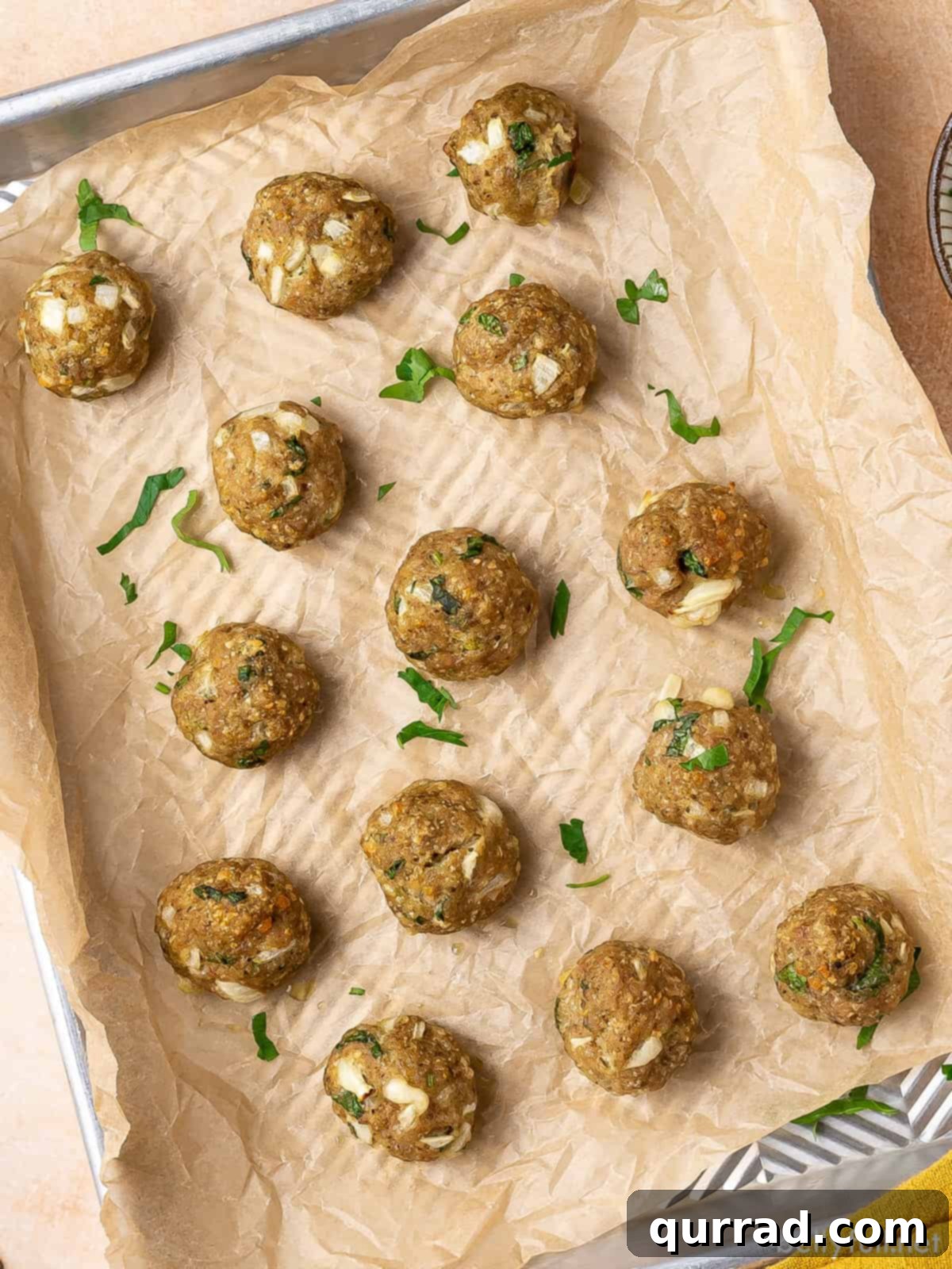 Savory Turkey Meatballs 3 Overhead view of turkey meatballs on a baking sheet