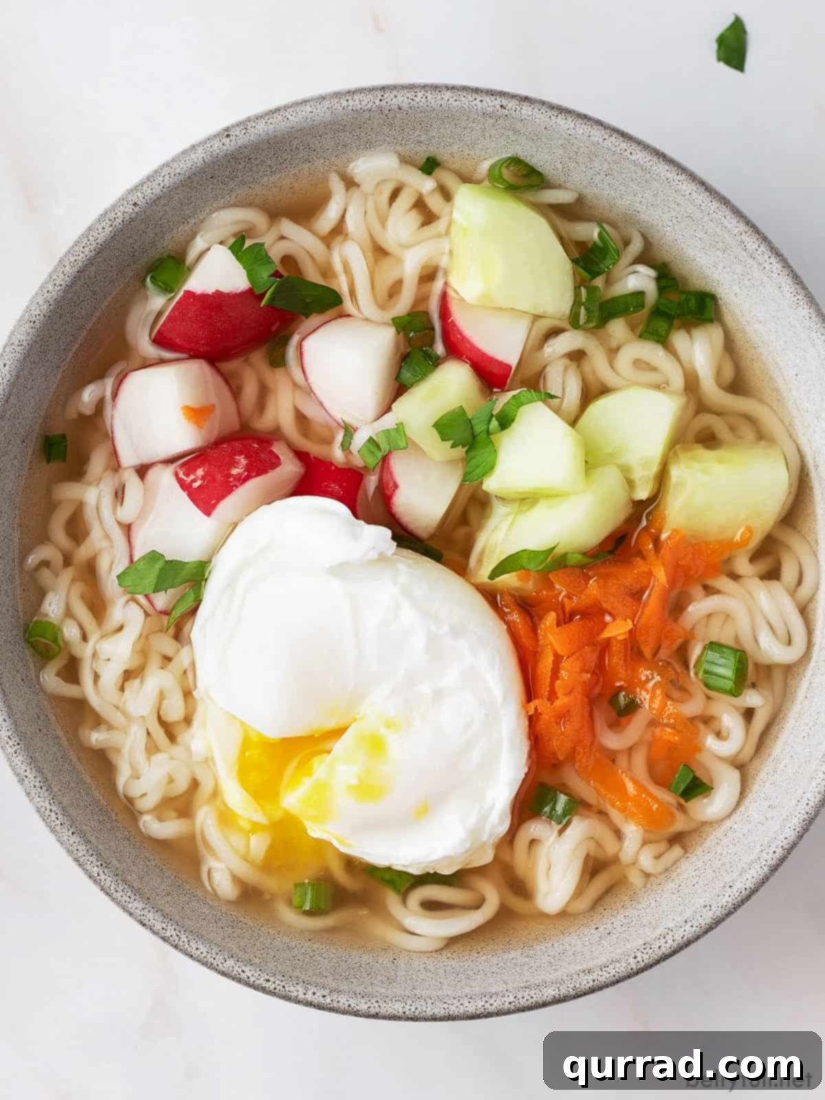 An inviting close-up of Hot and Sour Ramen Soup, showcasing the colorful array of fresh ingredients.
