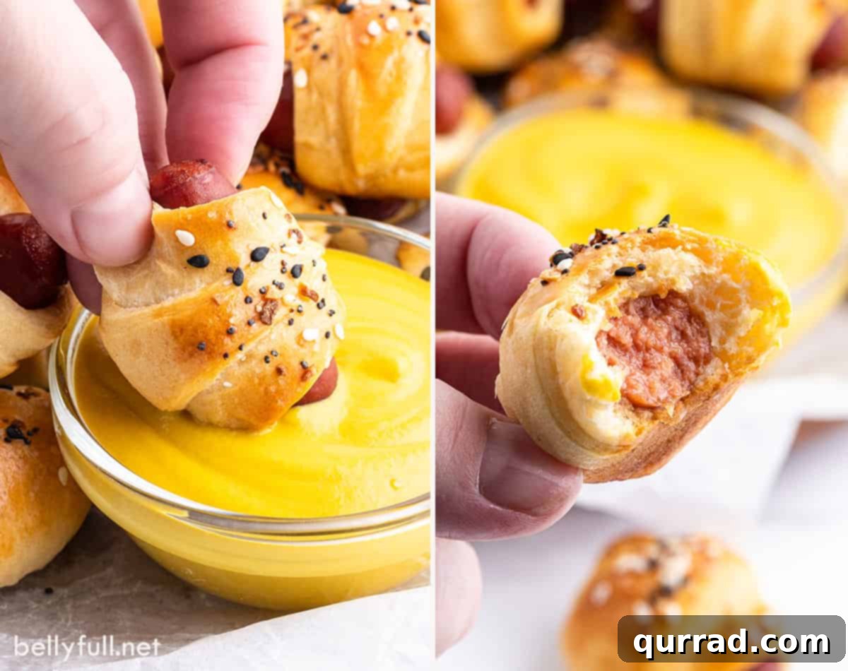 Cozy Canine Bites 5 A hand dipping a golden-brown mini pig in a blanket into a bowl of vibrant yellow mustard.